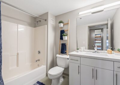 View of shared bathroom in a 4-bedroom unit.